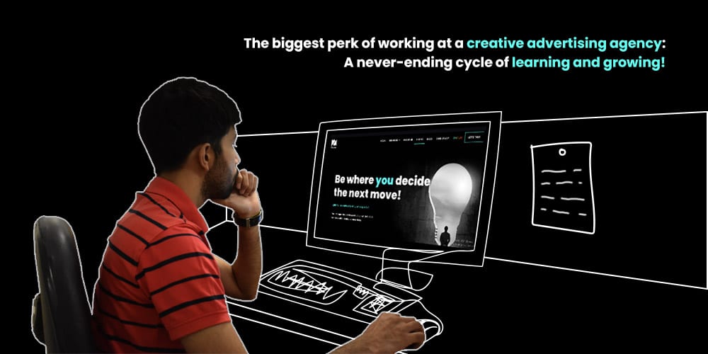 Person looking at a design on screen while working in a creative advertising agency.